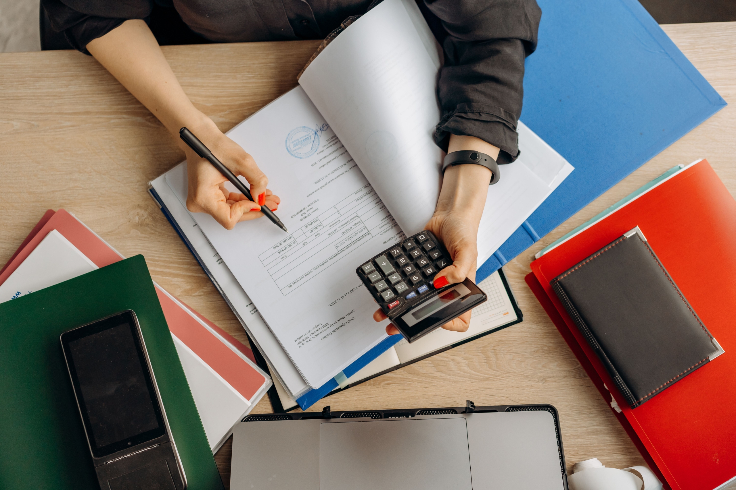 Person reviewing financial documents for Self Assessment