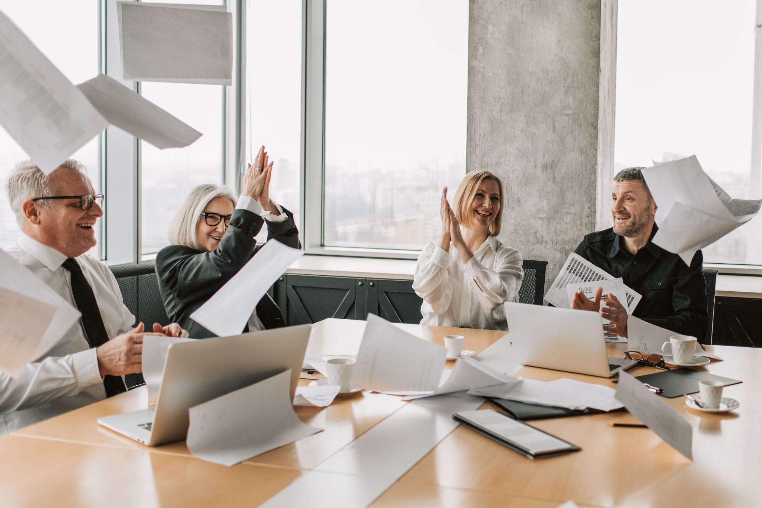 employees in office setting celebrating