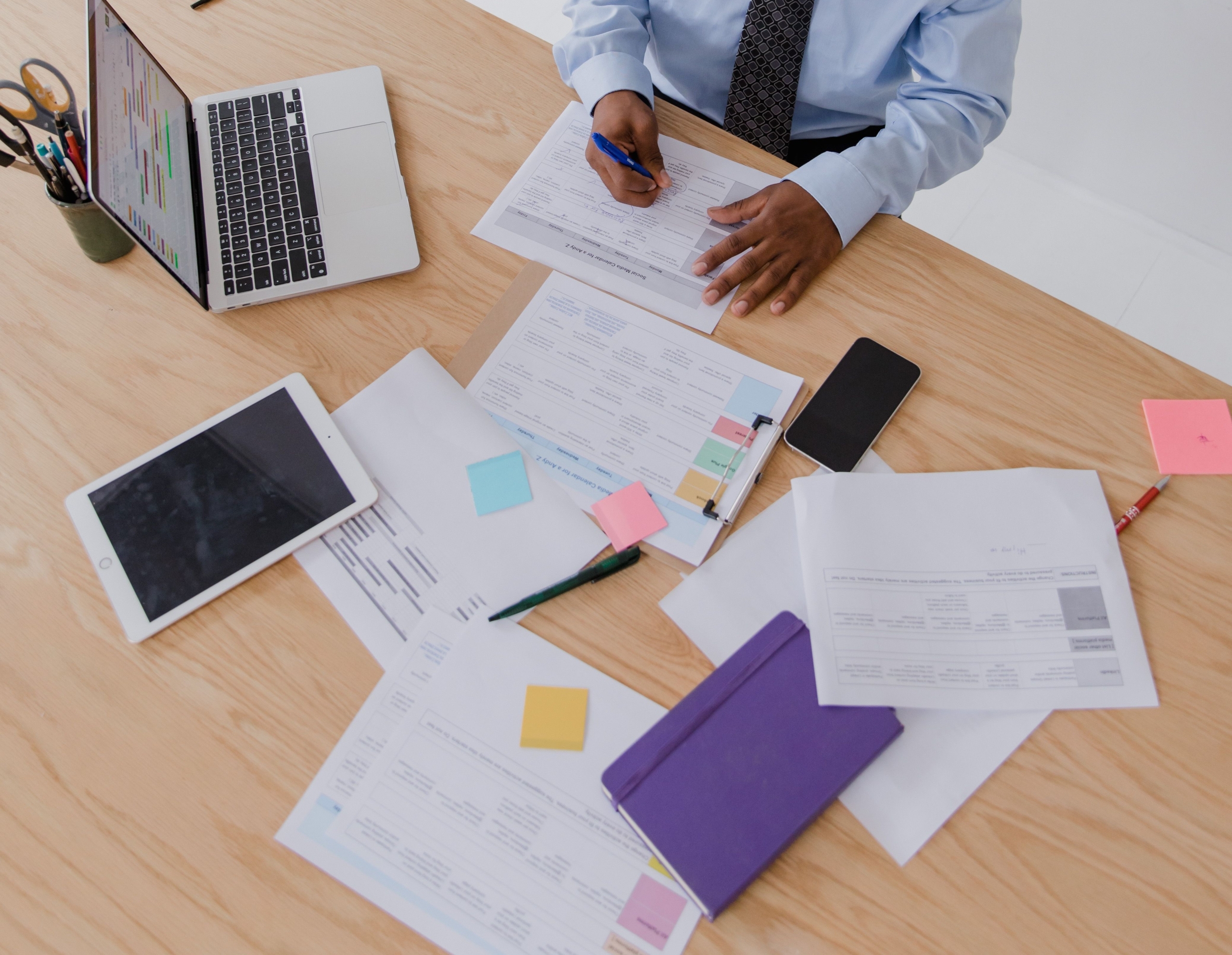 Business professional reviewing company documents for compliance